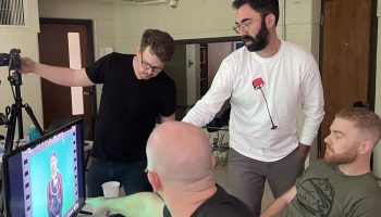 The Deafverse team discusses how to finetune the camera angle and lighting while Justin P. waits for feedback on his signing.