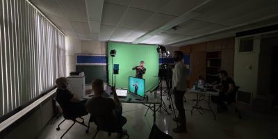 Justin narrates and acts out a scene while the rest of the Deafverse team looks on.
