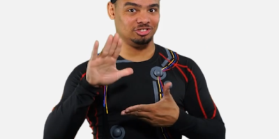 Justin Perez, Deafverse narrator, signs “college”.